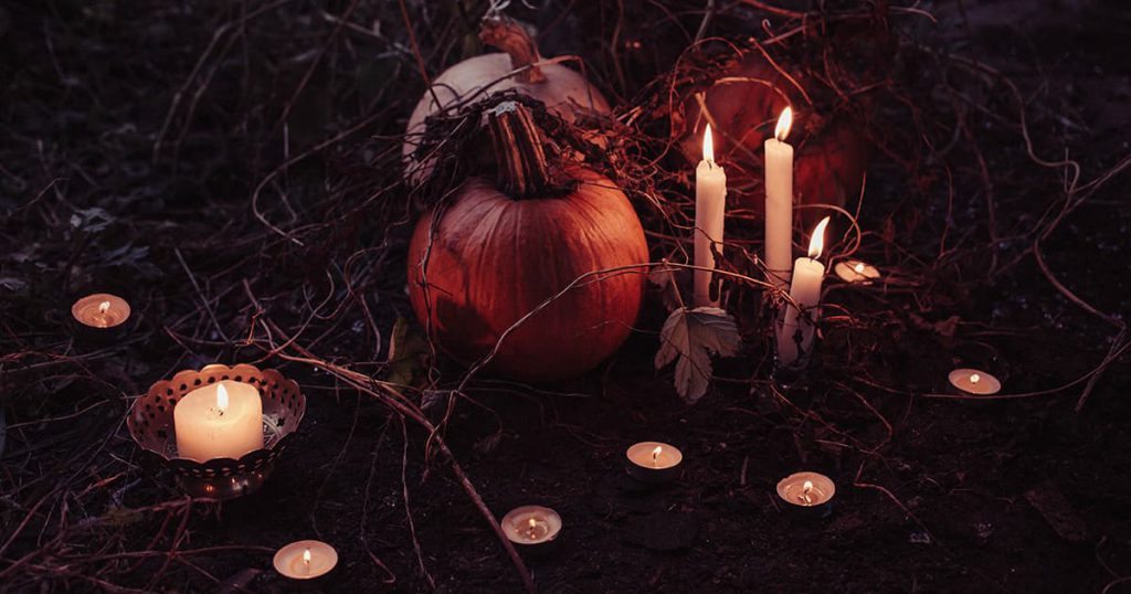 Witchcraft with pumpkins and candles
